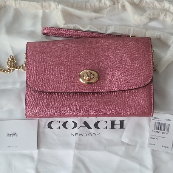 Coach Handbags - Coach Metallic Pink Wristlet Clutch